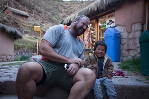 Greg with Quechua boy, Awanacancha